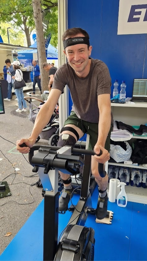 A participant riding an ergometer while wearing our sensor